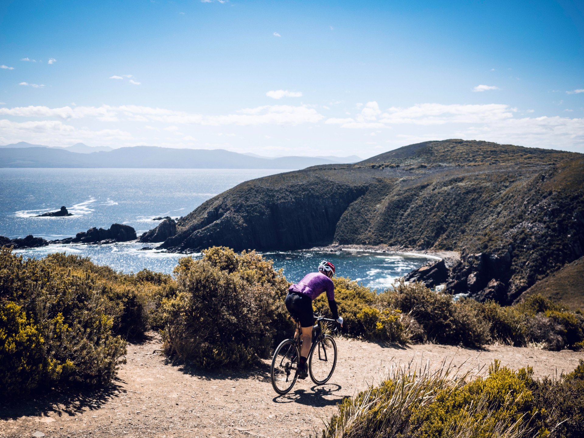 Golden-hour gravel road on the Bruny Island coast, Tasmania