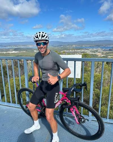 Richie Porte with his bike overlooking Tasmania, Dusty Chain inaugural ambassador